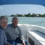 Couple in boat with island in background