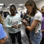 Girls in STEM participants with clipboards