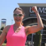 Mary Anne Hanson flexing outside UAMS ortho clinic